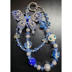 Blue butterfly bag chain.